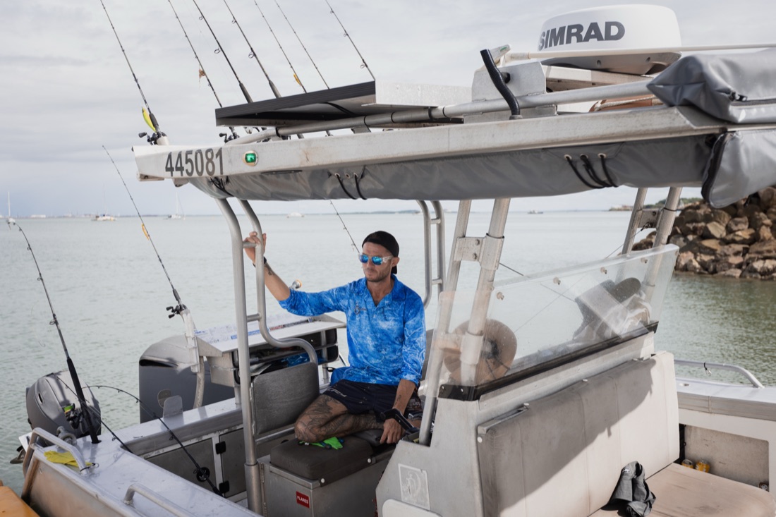 Skipper at the helm of the Salty Brumby on a Darwin offshore fishing charter