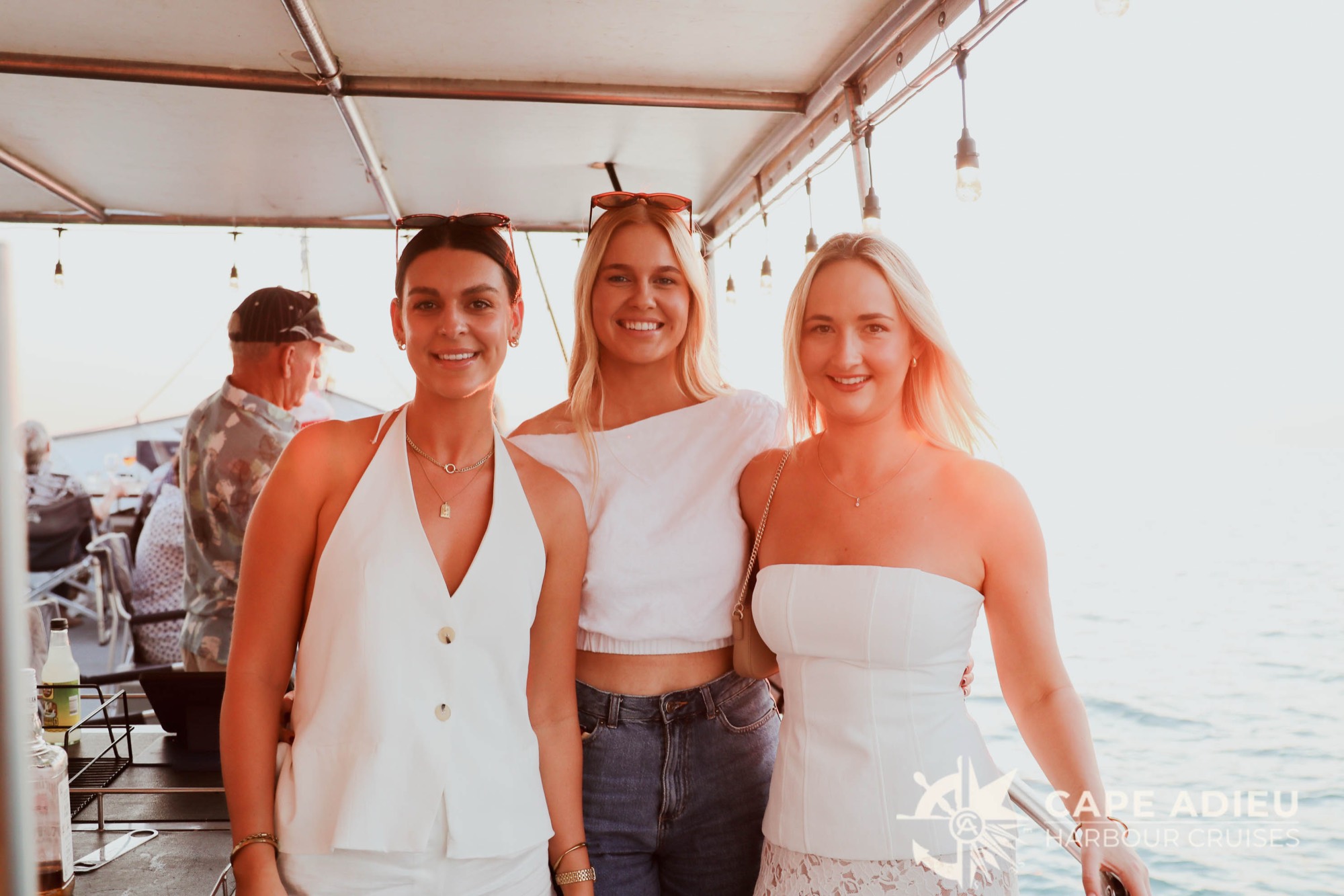 Friends celebrating a special occasion aboard Cape Adieu on Darwin Harbour